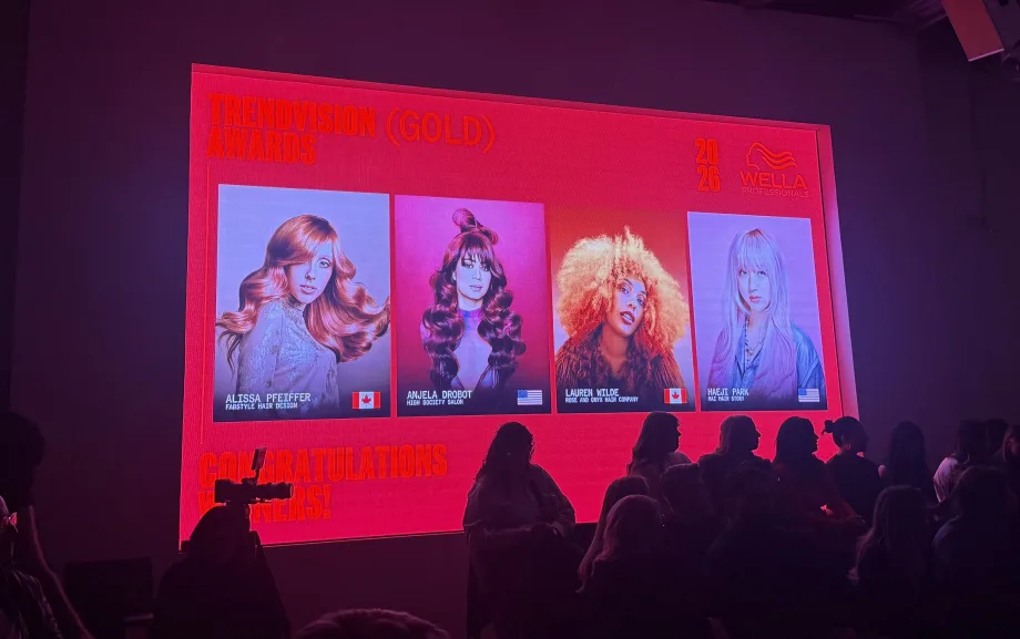 A photo of a screen that shows four model images
