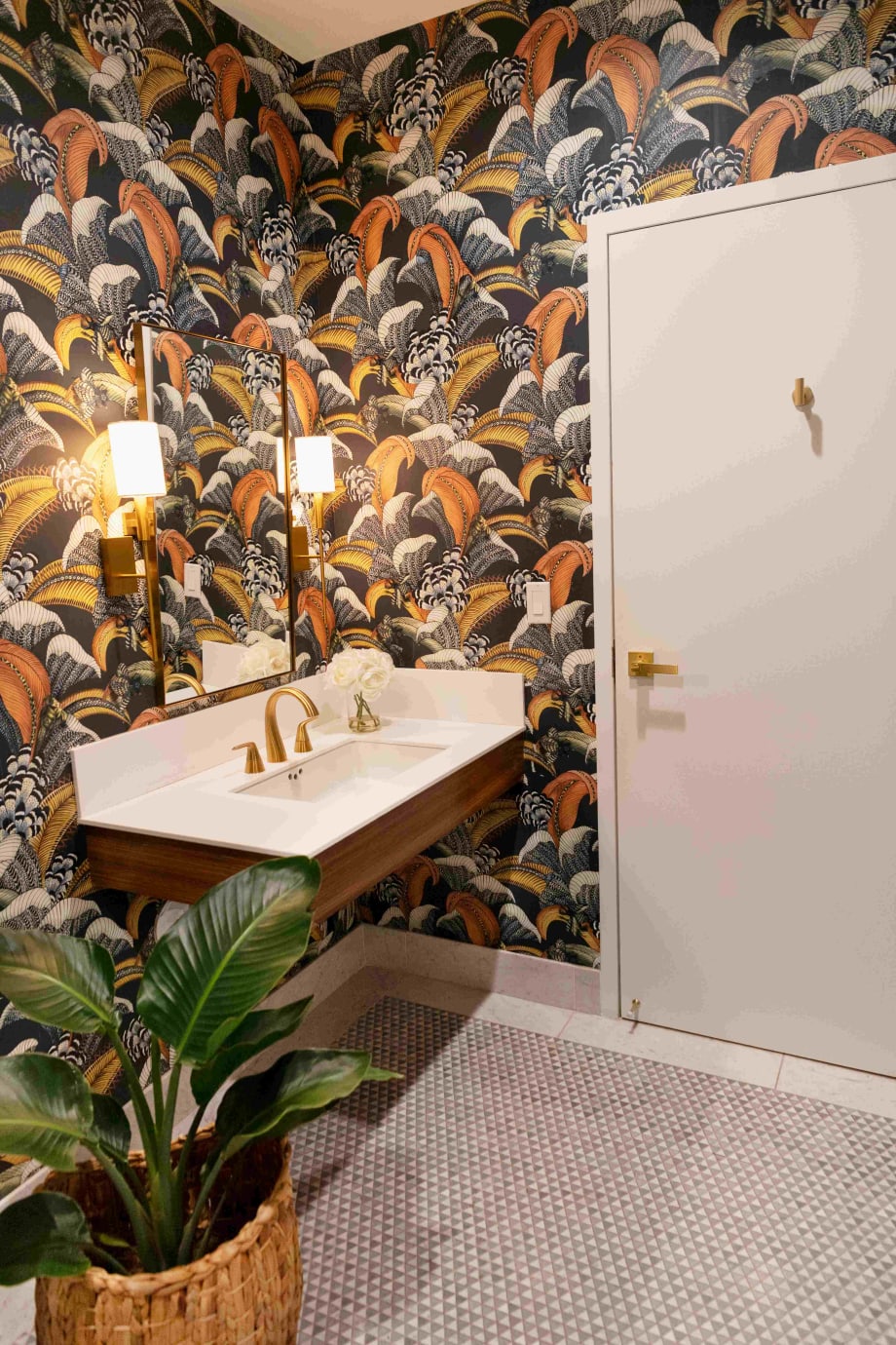 Floral wallpaper in an elegant salon bathroom.
