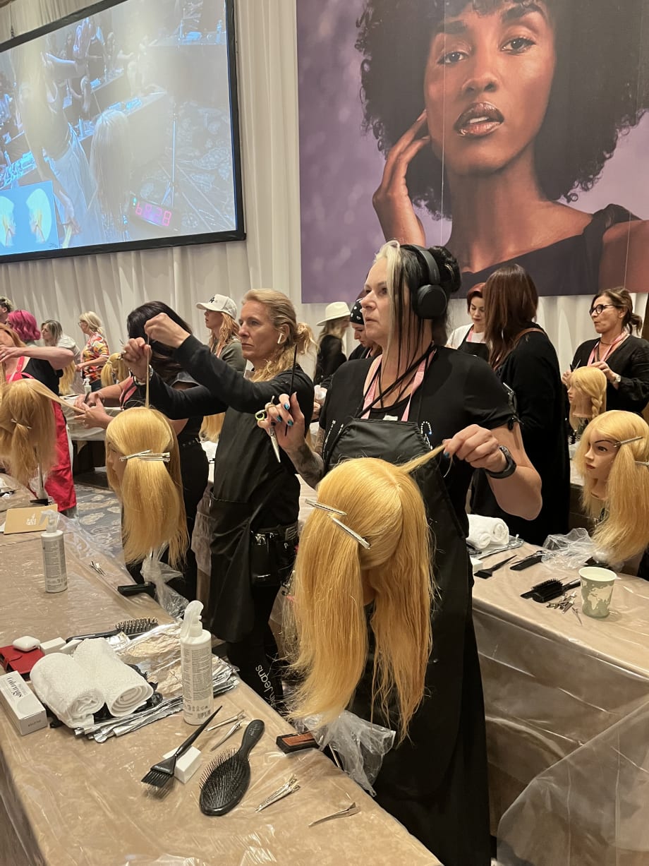 Attendees at Paul Mitchell’s Desert Bloom event in Las Vegas, a global gathering of hairstylists and salon professionals celebrating education, artistry, and community