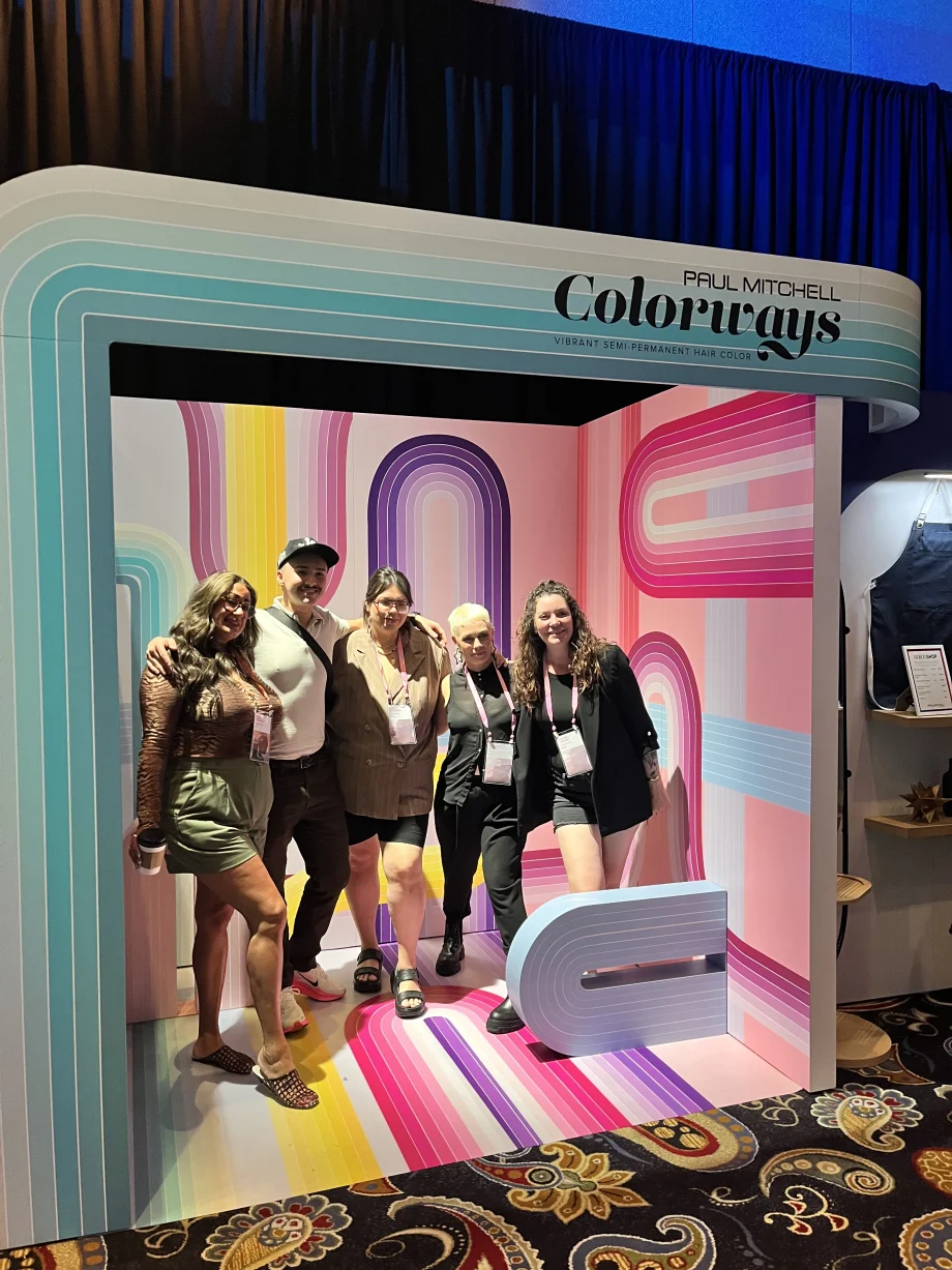 Beauty professionals pose during Paul Mitchell’s Desert Bloom event, held in Las Vegas