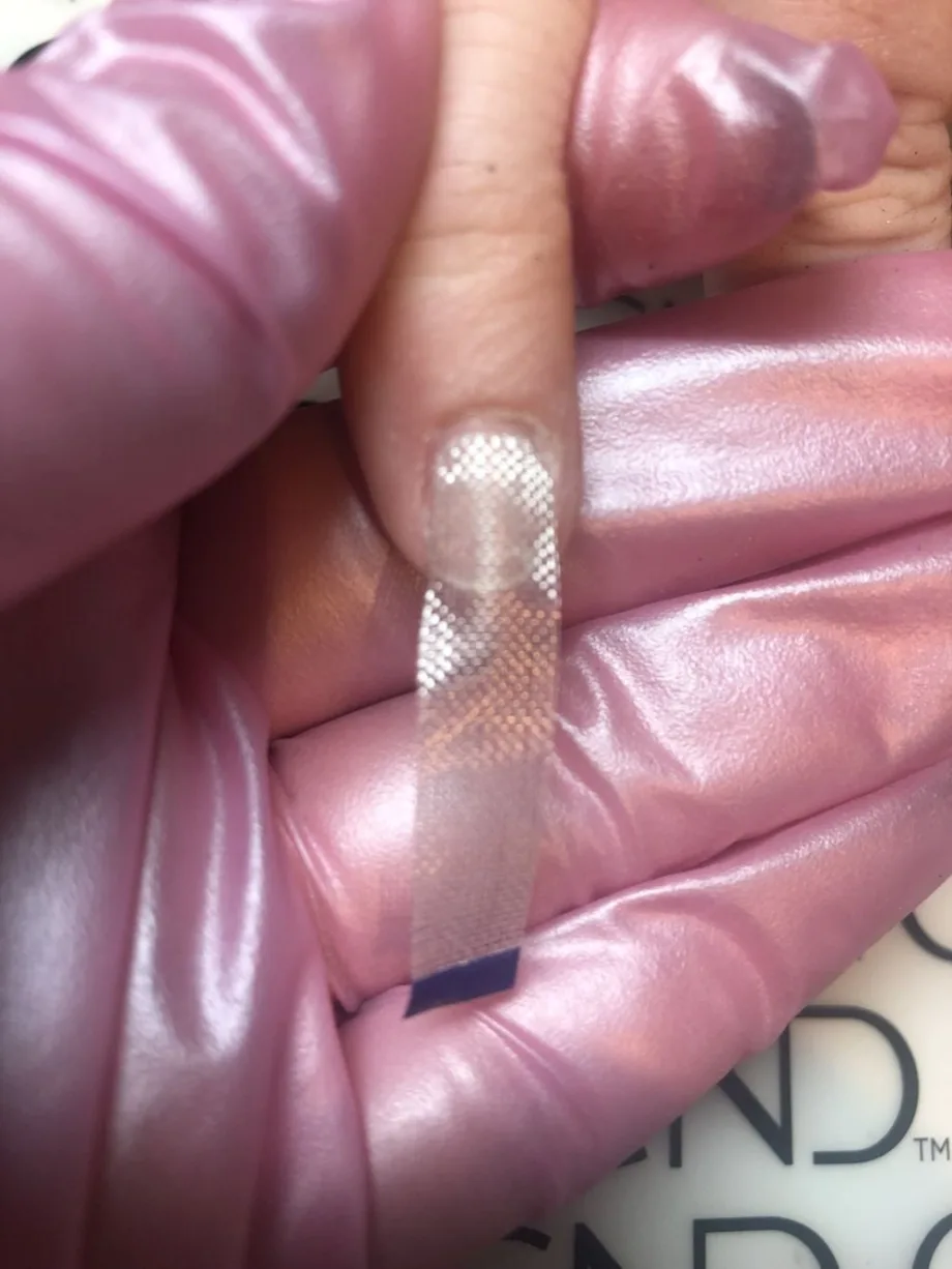 How to Use Fiberglass or Silk for Nail Repairs
