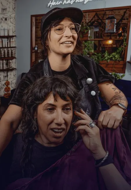 Hair Has No Gender is the nonprofit founded by Chicago stylist and salon owner, Jamie DiGrazia, shown here with a client.