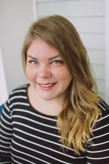 Former salon owner Jena Berenberg smiles into the camera.