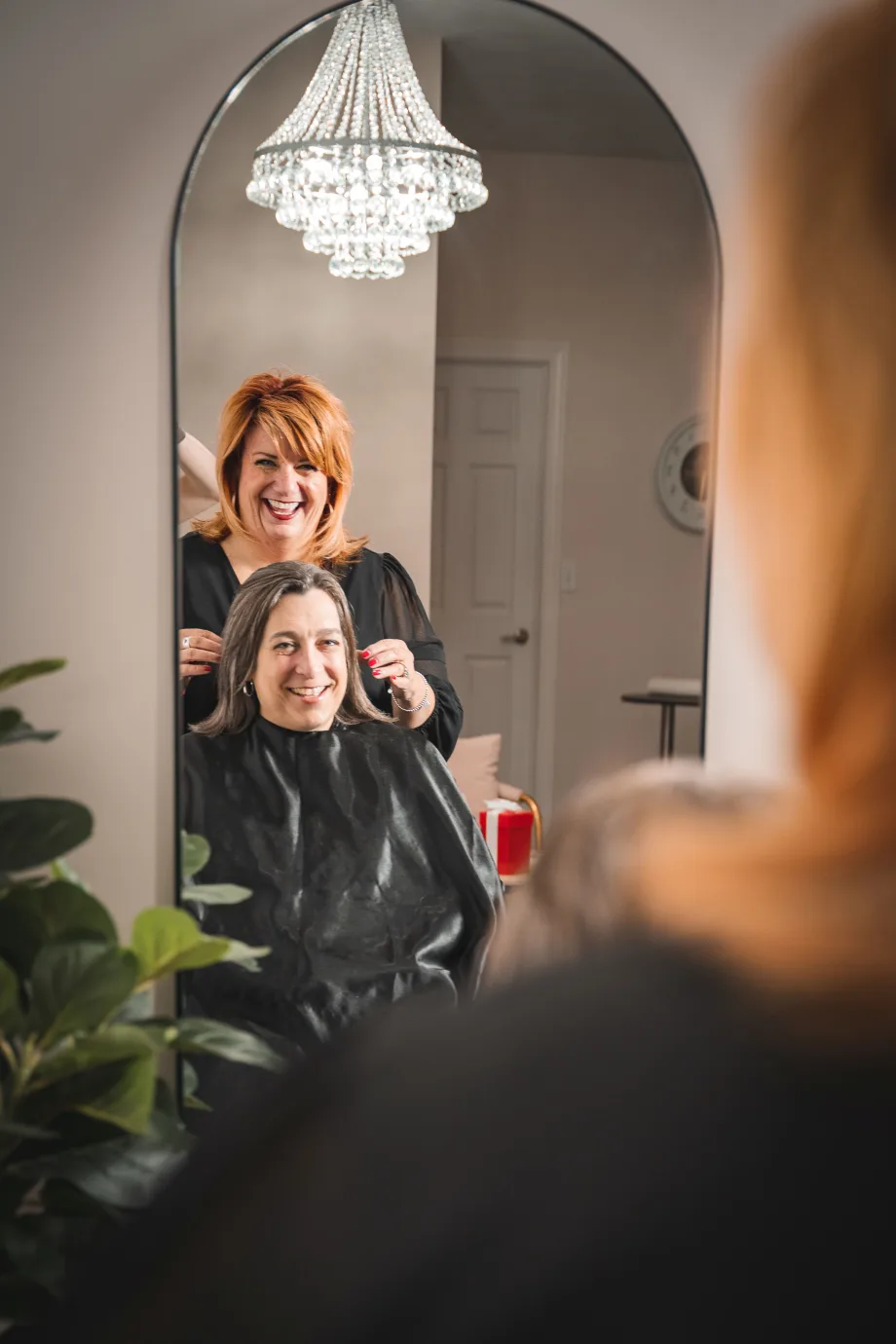 A hairstylist and a salon client