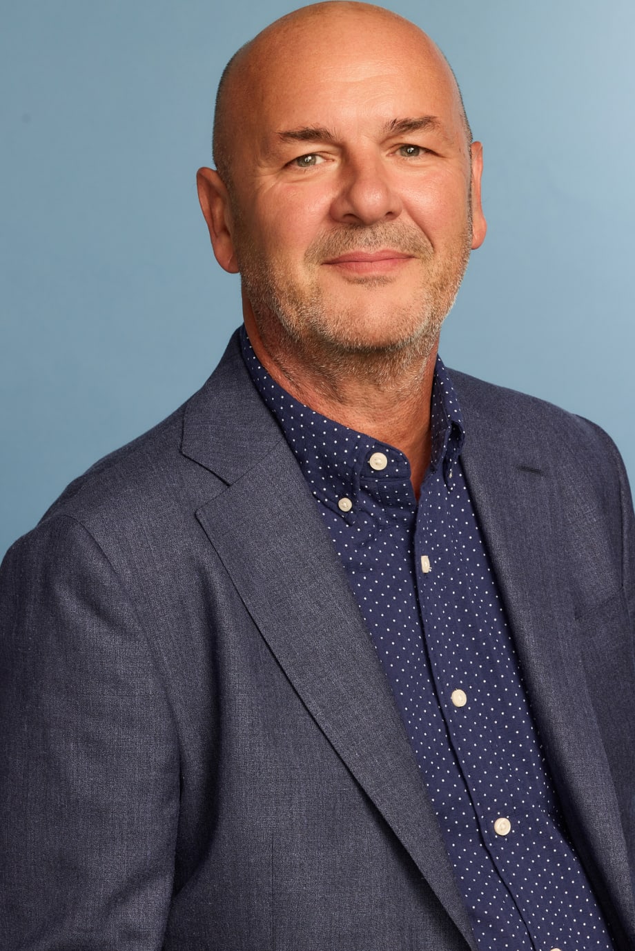 A man in a blue suit.