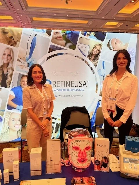Two women at a trade show booth