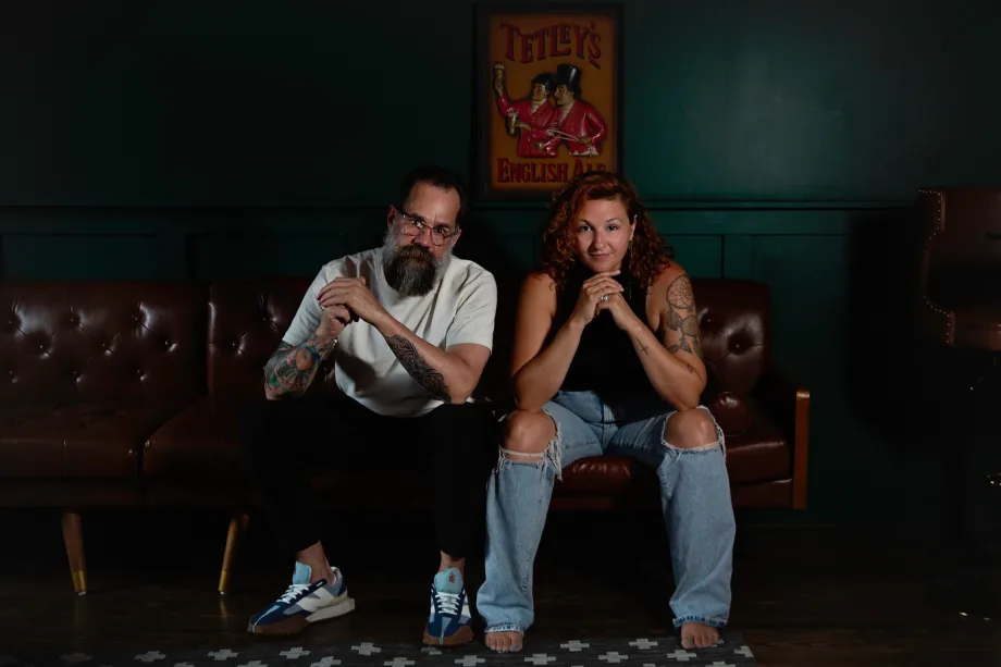 A man and a woman sitting on a couch