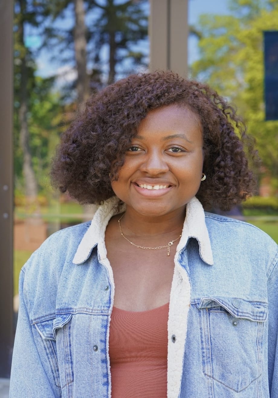 A young woman with curly hair