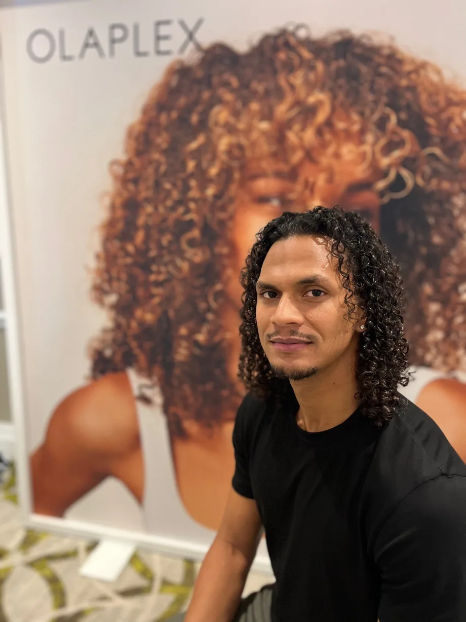 A man with curly hair.