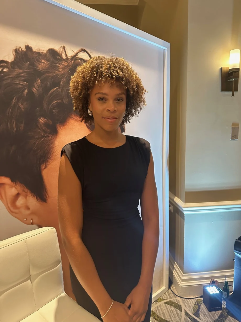 A woman with curly hair.