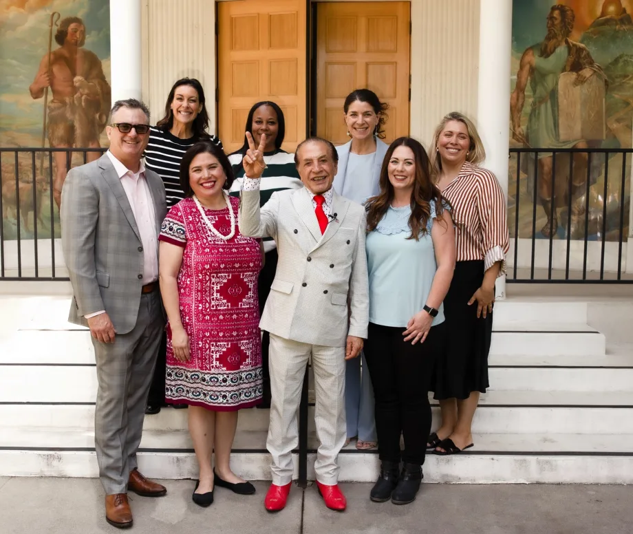 a group of people standing together on a set of stairs