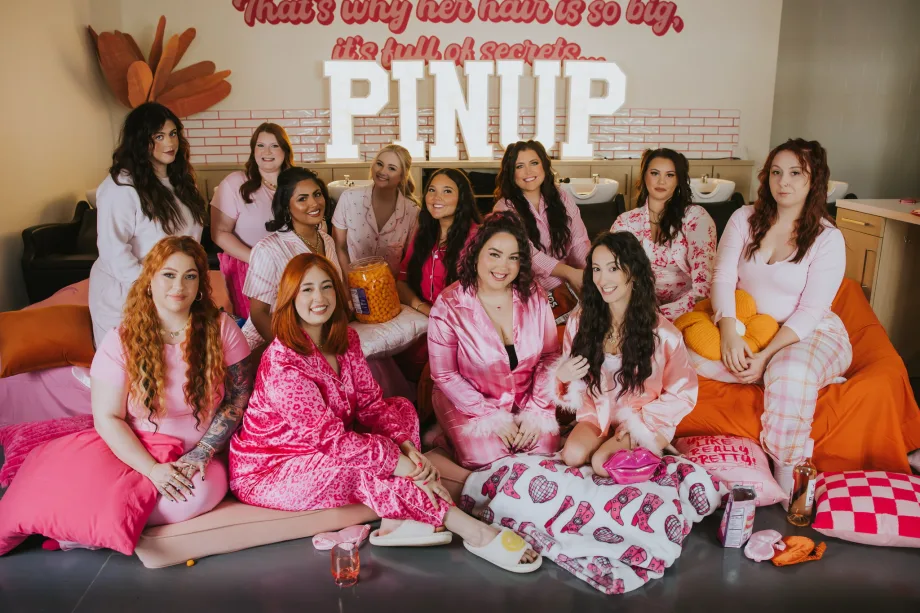 Pretty in pink, the team from Pinup Studio enjoy a pajama party in the salon.