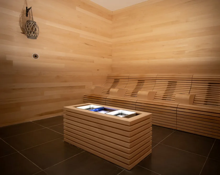 A wood paneled Sabbia Med Room in Excuria Salon and Spa.